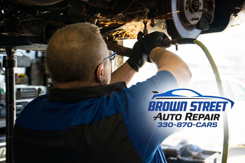 Mechanic grinding sparks at Brown Street Auto Repair